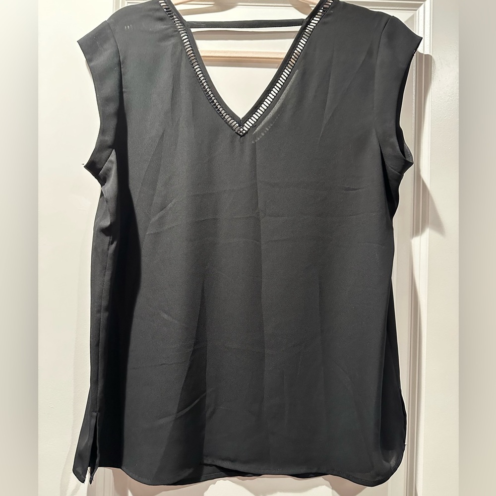 Black v-neck blouse with unique neckline. Size S.
